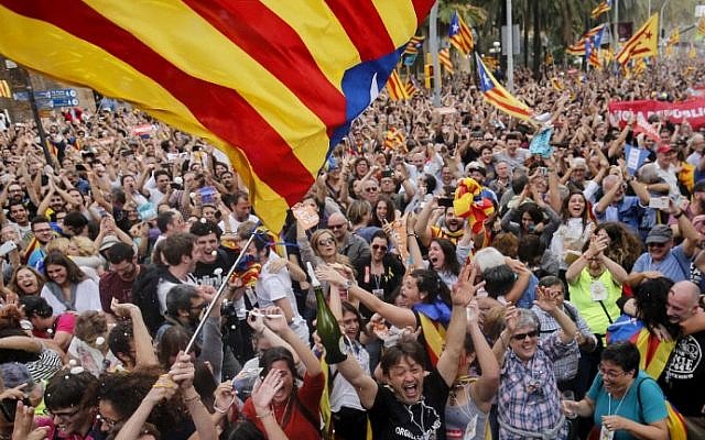 Catalans celebrate as parliament votes to declare independence