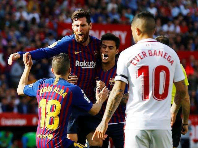 Messi makes history in Barcelona's 4-2 win over Sevilla