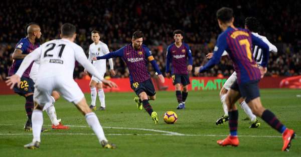 Messi makes history in Barcelona's 2-2 draw with Valencia