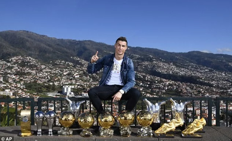 Cristiano Ronaldo Poses With His 15 Individual Trophies