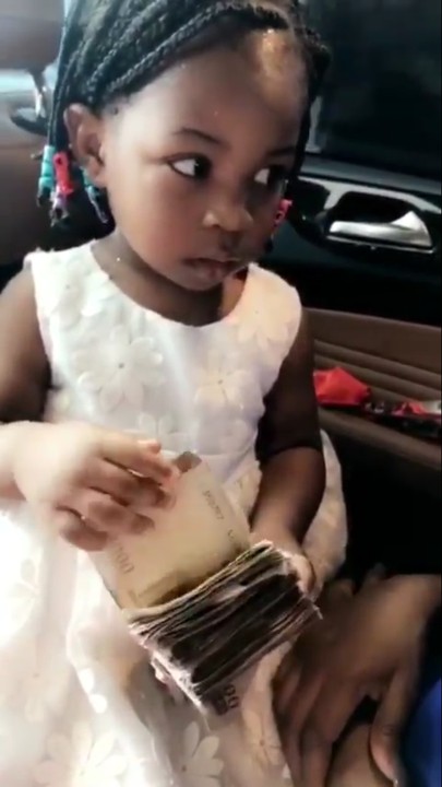 Davido Gifts His Daughter Imade Naira Notes & Flowers As Valentine Gift (Photos/Video)