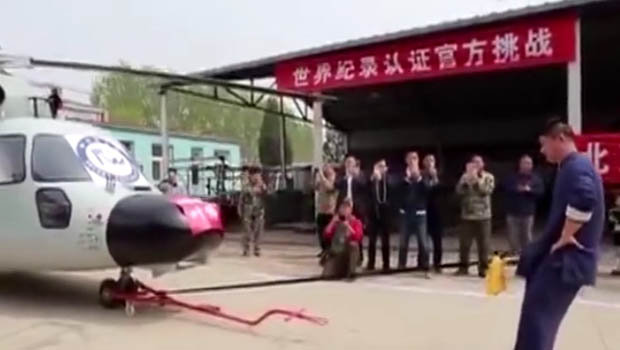 Kung Fu Master Sets New World Record After Using His P*nis to Pull Helicopter (Photos)
