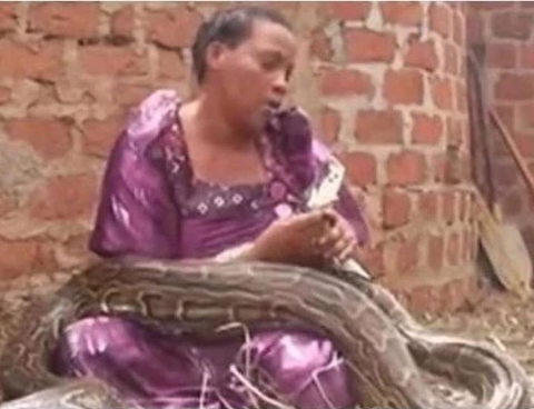 Shocking Story: Ugandan Woman Claims to Have Given Birth to Twins Which One is a Snake (Photos)