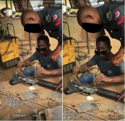 Nigerian Policeman Spotted Repairing His Gun at a Welder's Workshop (Photos)