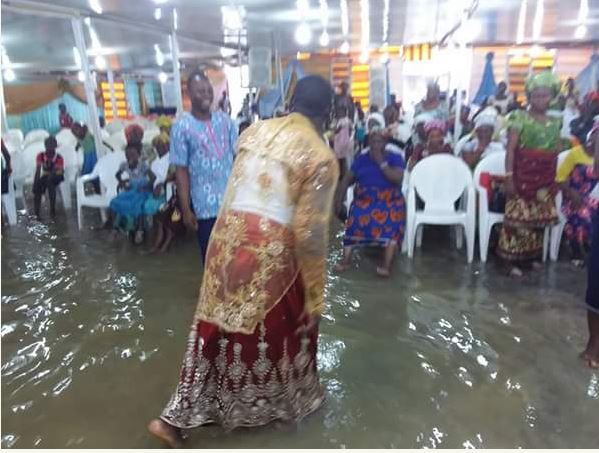 Delta Pastor and His Church Members Seen Worshipping Inside Flooded Church (Photos)