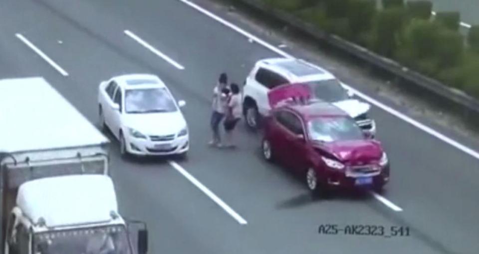 Omg! Couple Holding Their Baby Narrowly Escape Death as Car Smashes Into Their Broken-Down Car  (Photos)