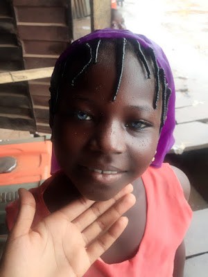 See Beautiful Photos of a Young Nigerian Girl with Striking Blue Eyes