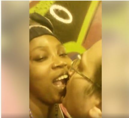 Drama as Nigerian Woman Gets Sensual with White Man in Public (Photos)