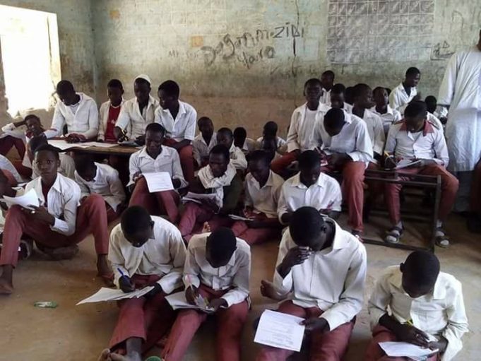 Shame! Secondary School Students Sit on Bare Floor to Write Exam in Sokoto State (Photos)