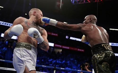 Spectacular Mayweather Beats McGregor by TKO in Big Money Fight (Photos)