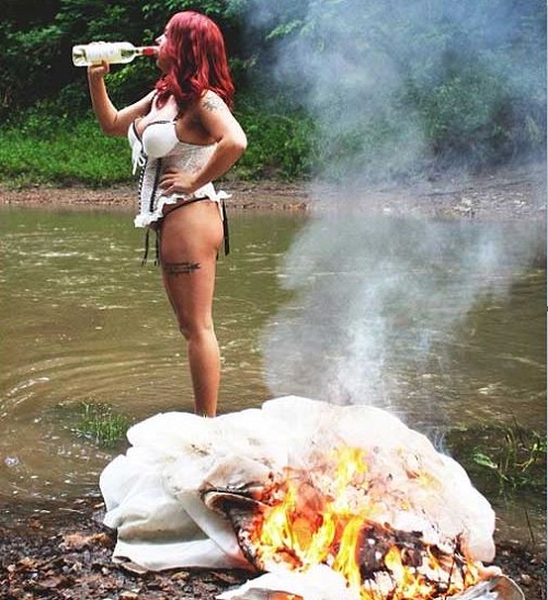 Omg! Woman Celebrates Divorcing From Her Husband By Setting Her Expensive Wedding Dress on Fire (Photo)