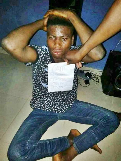 Man Caught With a Stolen Gucci Shirt, Forced to Pose with 'I'm Original Criminal" Placard