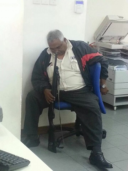 Security Guard in Trouble After Being Caught Sleeping on Duty in Abuja... Checkout His Punishment