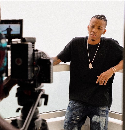 Tekno shoots music video in Miami, cuddles US-Based Model