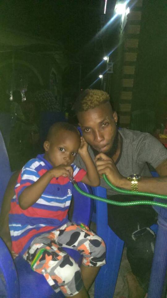 Nigerian father defends his actions of teaching his really young sons how to smoke shisha. (Photos)