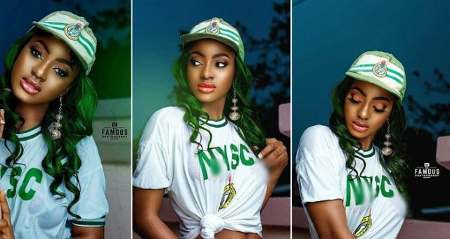Corps member displays nip.ples, bo.obs in wet NYSC crested vest. (Photos)