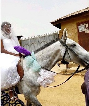 Bride rides a horse to her wedding in Jos, Plateau State.