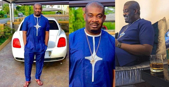 Don Jazzy poses with his white Bentley continental flying spur. (Photo)