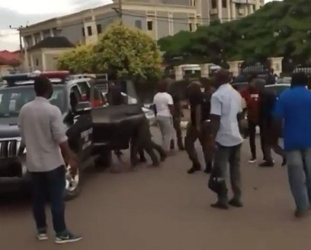 Nigerian police beat up and bundle suspected 'Yahoo boys' into a van in Benin. (Photos + Video)