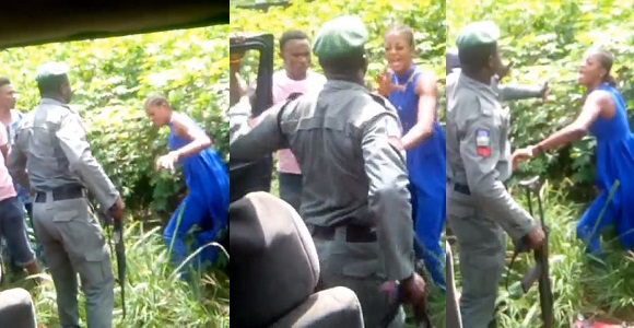 Nigerian policeman captured on camera beating a lady for refusing to allow him check her bag along Warri/Sapele road. (Video)