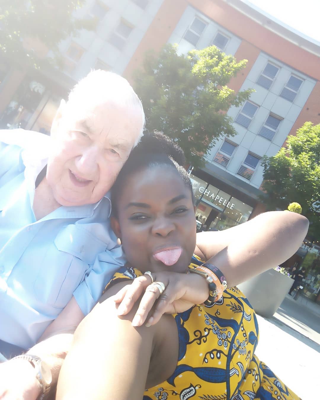 Ghanaian lady slams troll who mocked her 90-year-old white husband.