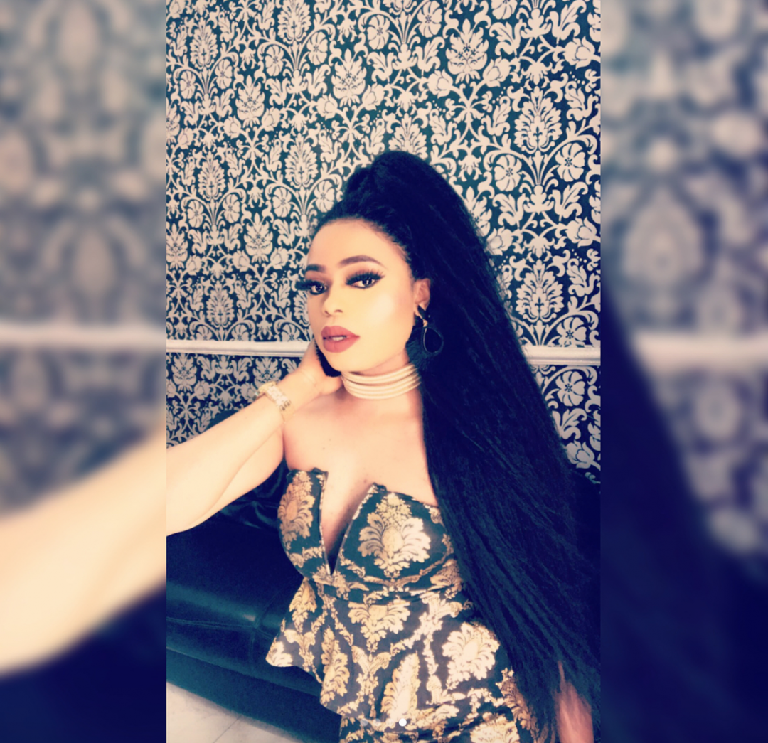 Bobrisky displays cleavage in new photos; fans react.