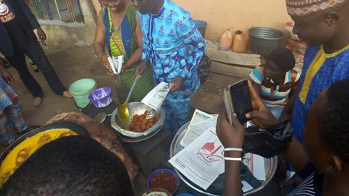 Ekiti Governorship candidate, Kolapo Olusola, spotted frying Akara as he campaigns for votes. (Photos)