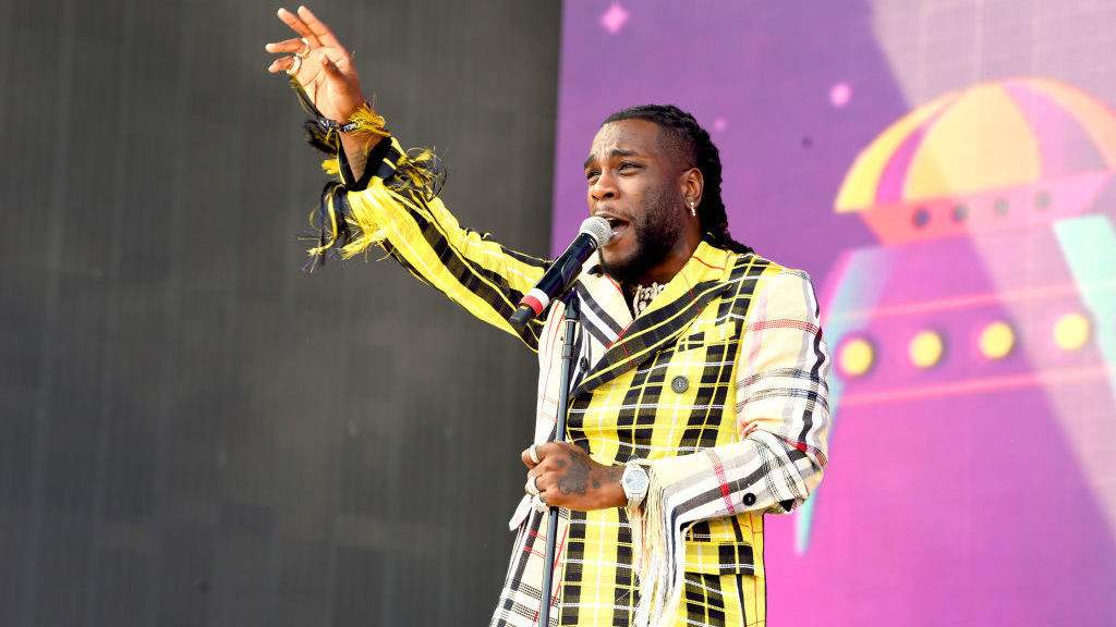 Burna Boy walks a fan out of his show for not vibing to his performance (Video)