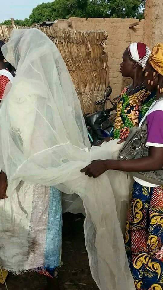 Chai!! Poor Bride Weds Wearing A Mosquito Net And Bag Of Rice As Her Wedding Gown