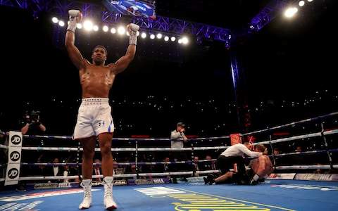 Anthony Joshua knocks out Alexander Povetkin in the seventh round to retain world heavyweight titles