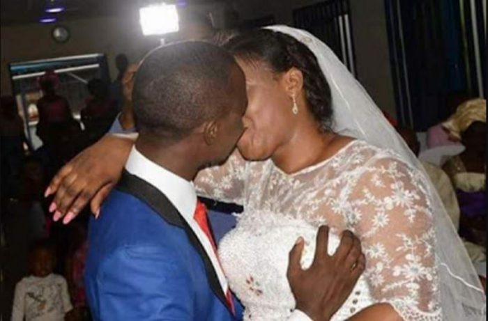 Excited Groom Grabs His Bride By The Chest While Kissing During Their Wedding Ceremony (Photos
