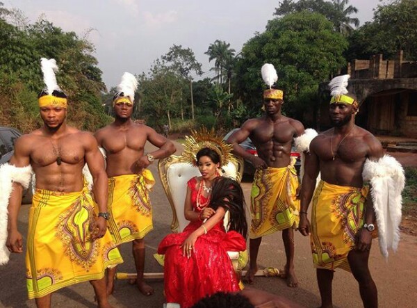 Couple Arrive Their Traditional Wedding In Wooden Platforms Carried By Muscular Guys