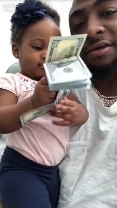 Baddest! See As Davido's 1-Year-Old Daughter Plays With Dollar Notes