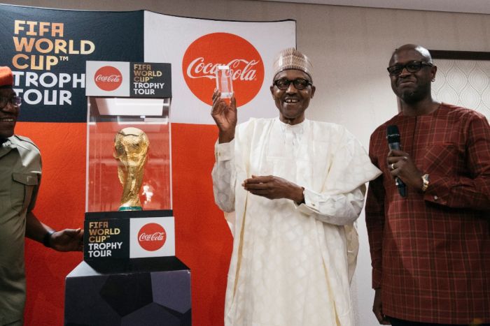 Photos:- The Moment The FIFA World Cup Trophy Was Lifted By The President Of Nigeria