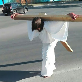 Man Arrested For 'Impersonating Jesus' After He Is Spotted Walking With Giant Cross On His Back