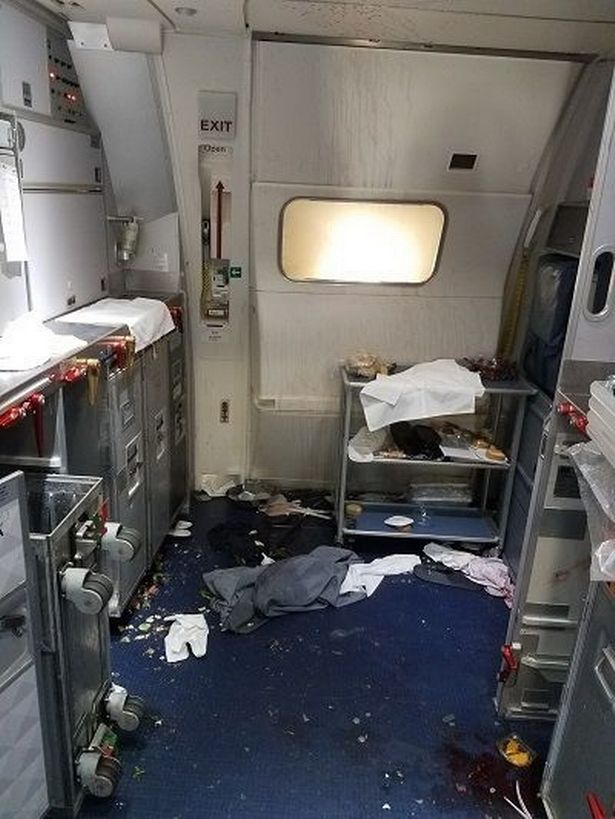 Female Flight Attendants Break Wine Bottles Over Man's Head As He Tried To Open Plane Door Mid-Air