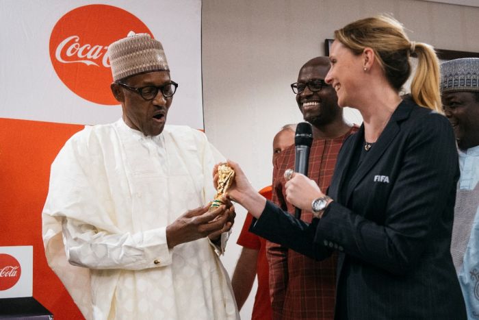 Photos:- The Moment The FIFA World Cup Trophy Was Lifted By The President Of Nigeria