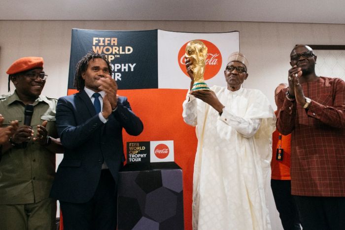 Photos:- The Moment The FIFA World Cup Trophy Was Lifted By The President Of Nigeria