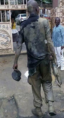Brave Security Officer Enters Gutter To Kill Masked Armed Robber In Port Harcourt [Photos]