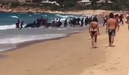 Video: Moment Boat With African Migrants Arrives Spanish Beach In Front Of Stunned Holidaymakers