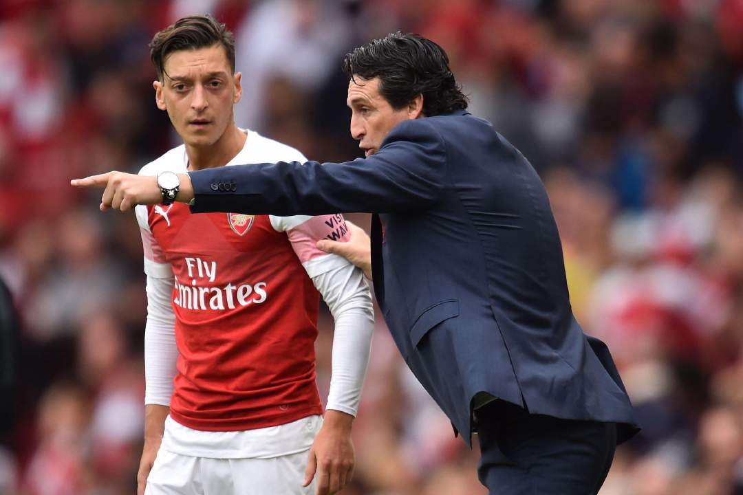 Arsenal manager Unai Emery must find a role for Mesut Ozil or sell him, says former Gunner Paul Merson