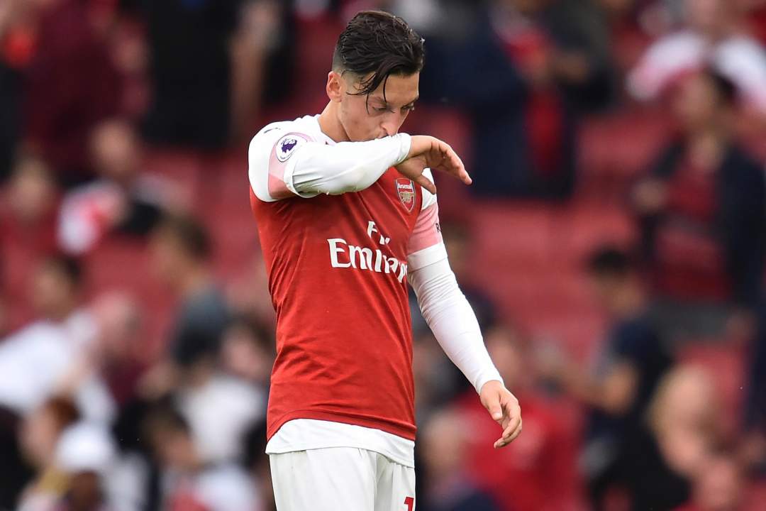 Arsenal manager Unai Emery must find a role for Mesut Ozil or sell him, says former Gunner Paul Merson