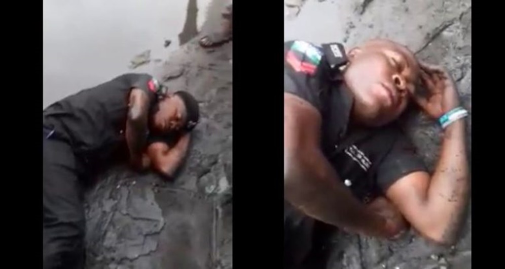 Drunk Nigerian Policeman Captured Sleeping Inside Mud (Video)