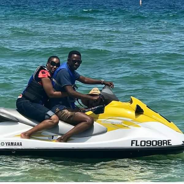 Pastor Sam Adeyemi Takes Wife On Romantic Getaway, Enjoys Jet Ski Ride With Her