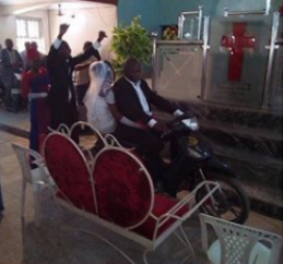 Groom Rides His Bride Down The Aisle With Motorcycle In Benue