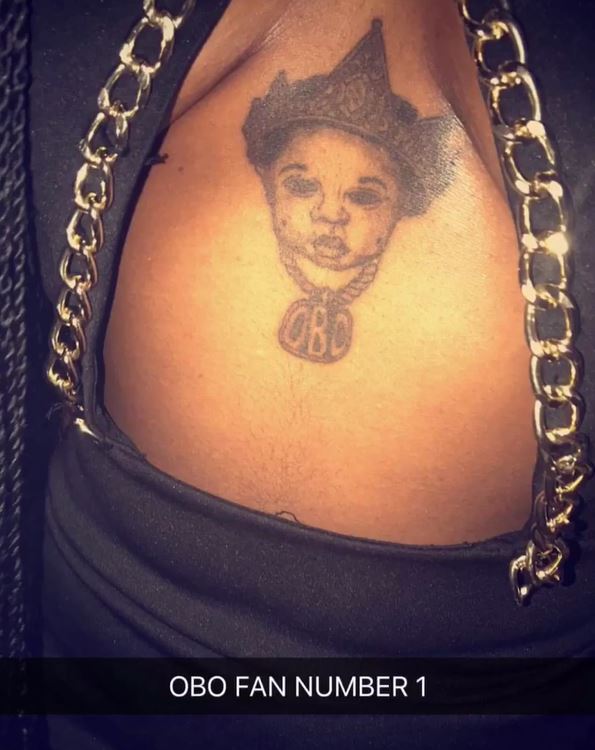 Another female fan gets a Davido tattoo on her chest (Video)