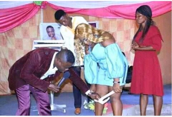 Viral photo of a 'Zambian prophet' removing a lady's underwear in church
