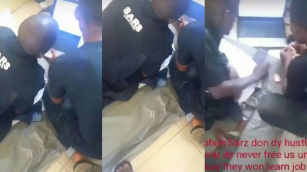 SARS operatives seen learning how to scam from suspected fraudsters after arresting them (Video)