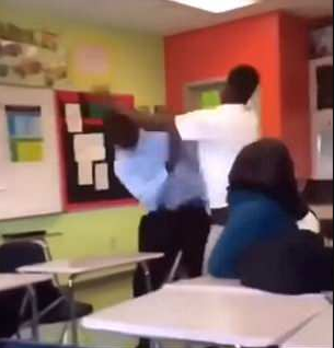 Teacher body slams a pupil who punched him in the face onto a desk and beats him (photos/videos)