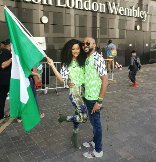 Adorable photos of Banky W and Adesua Etomi twinning in their Nigerian jersey at Wembley stadium